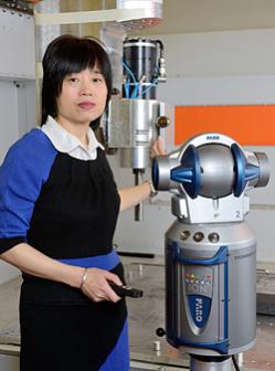 P‌ictured with the University's new Faro laser tracker ION IFM model is research fellow Dr Xiaomei Chen.
