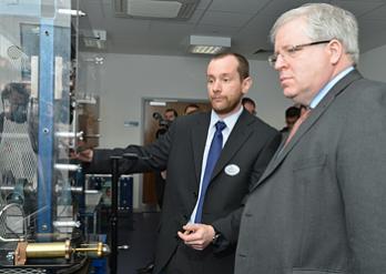 The Secretary of State watching a demonstration of some of the IRR's specially-installed rigs simulating the crucial and complex areas of contact between rail and wheel.