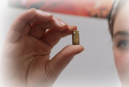 University of Huddersfield researcher holding bullet